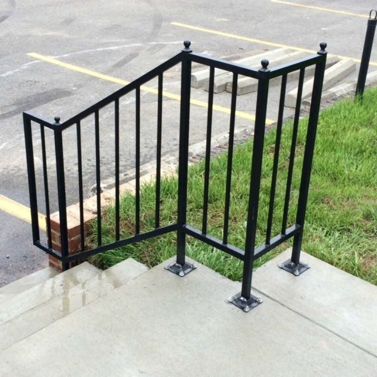 a wrought iron railing on a set of stairs