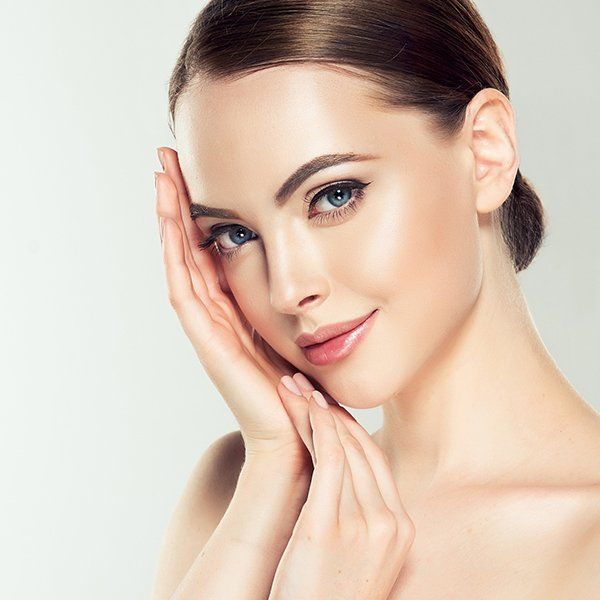 Beautiful Lady Touching Her Face — Fort Worth, TX — Pam Hebert Laser and Electrolysis