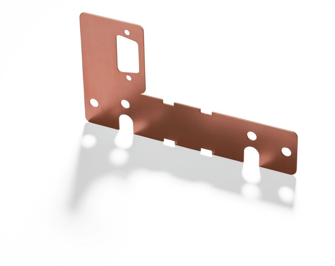 Copper-colored, L-shaped metal bracket with cutouts and mounting holes, casting a shadow on a white surface.