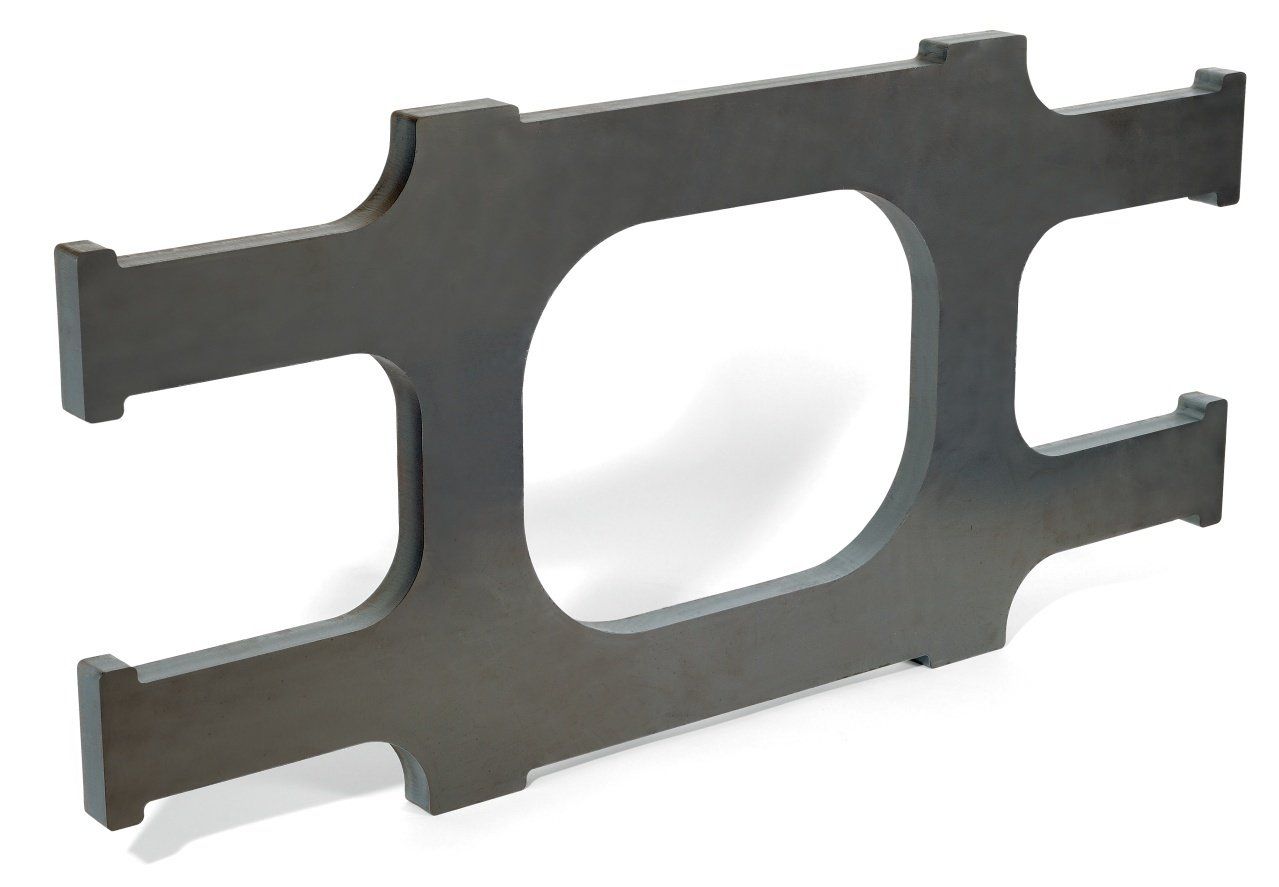A dark gray, rectangular metal bracket with a large open center and protruding tabs on the sides.
