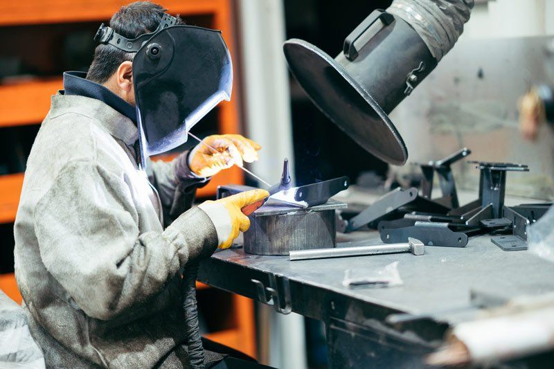 portrait of working welder