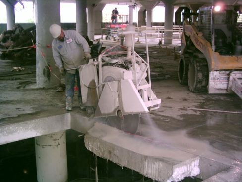 Man at a building site in need of professional concrete cutting or core drilling