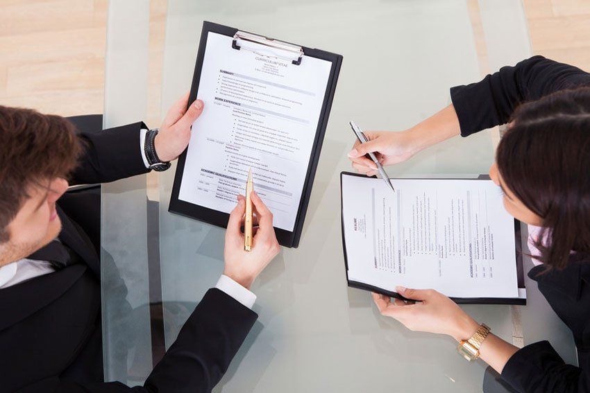 two people checking the documents