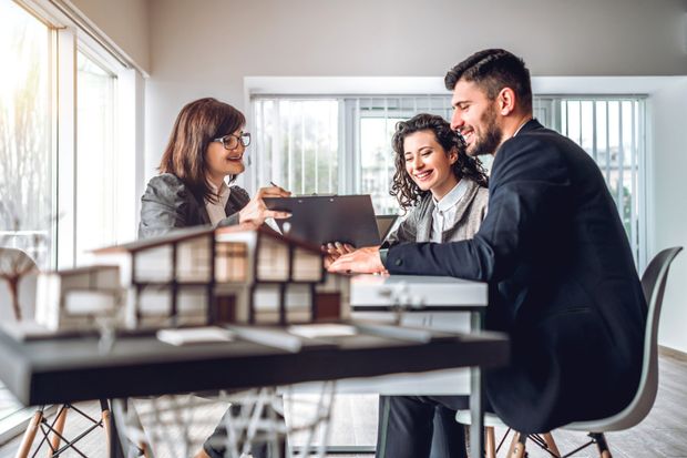 Insurance Agent and Couple Discussing — Michigan City, IN — Snyder Insurance Agency Insurance Agent and Couple Discussing — Michigan City, IN — Snyder Insurance Agency