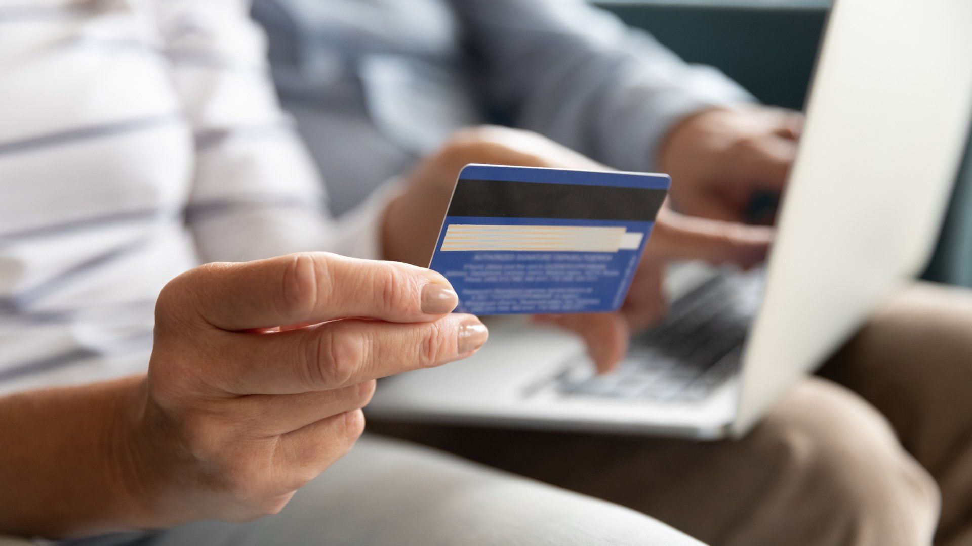 Couple Making Payment Online — Michigan City, IN — Snyder Insurance Agency