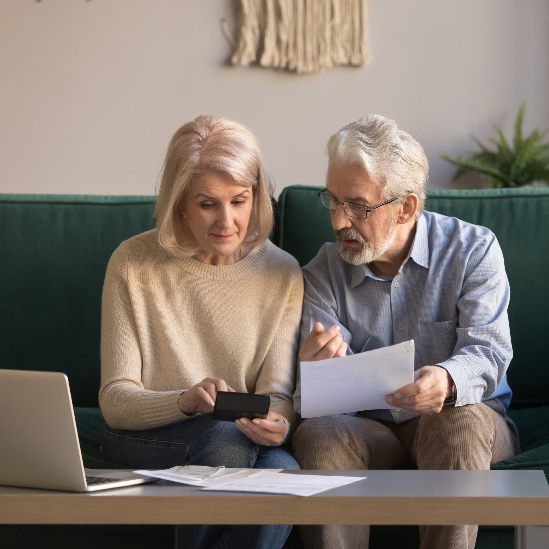 Senior Couple Looking at Documents — Michigan City, IN — Snyder Insurance Agency Senior Couple Looking at Documents — Michigan City, IN — Snyder Insurance Agency
