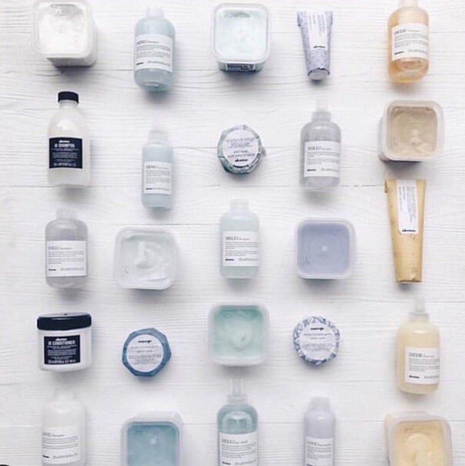 A bunch of different bottles and containers on a table