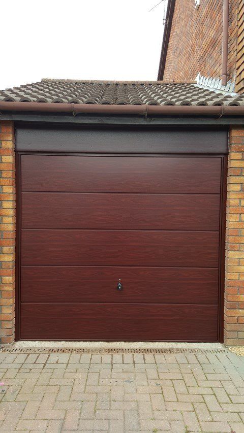 Wooden sectional garage door