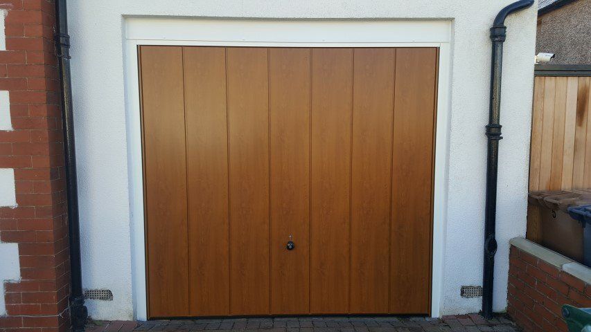 Vertical sectional garage door