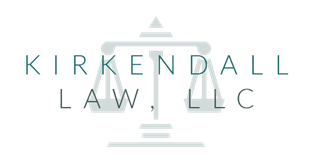 Kirkenndall Law LLC logo with a scale of justice icon.