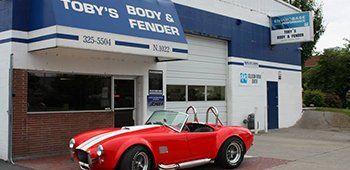 Auto Collision — Red Car in Front of Office in Spokane, WA Auto Collision — Red Car in Front of Office in Spokane, WA