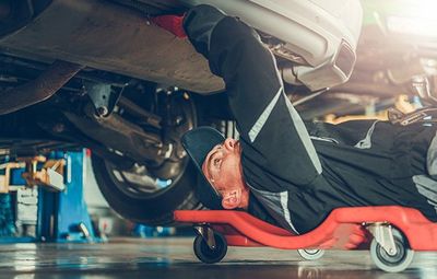 Auto Repair — Mechanic Under the Car in Kennett Square, PA