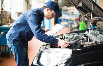 Auto Air Conditioning Service — Mechanic At Work In His Garage in Kennett Square, PA Auto Air Conditioning Service — Mechanic At Work In His Garage in Kennett Square, PA