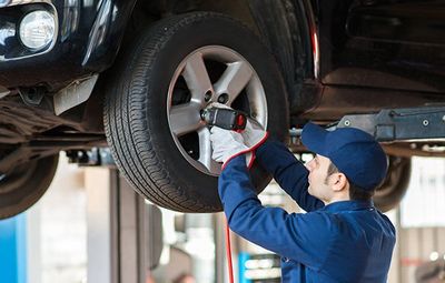 New Tires — Mechanic Changing The Car Tire in Kennett Square, PA New Tires — Mechanic Changing The Car Tire in Kennett Square, PA