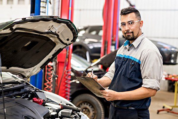 Inspections — Mechanic Inspecting The Car in Kennett Square, PA