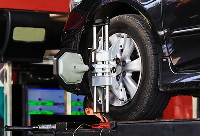 Performance Car Repair — Computerized Wheel Alignment Machine Clamp in Kennett Square, PA Performance Car Repair — Computerized Wheel Alignment Machine Clamp in Kennett Square, PA