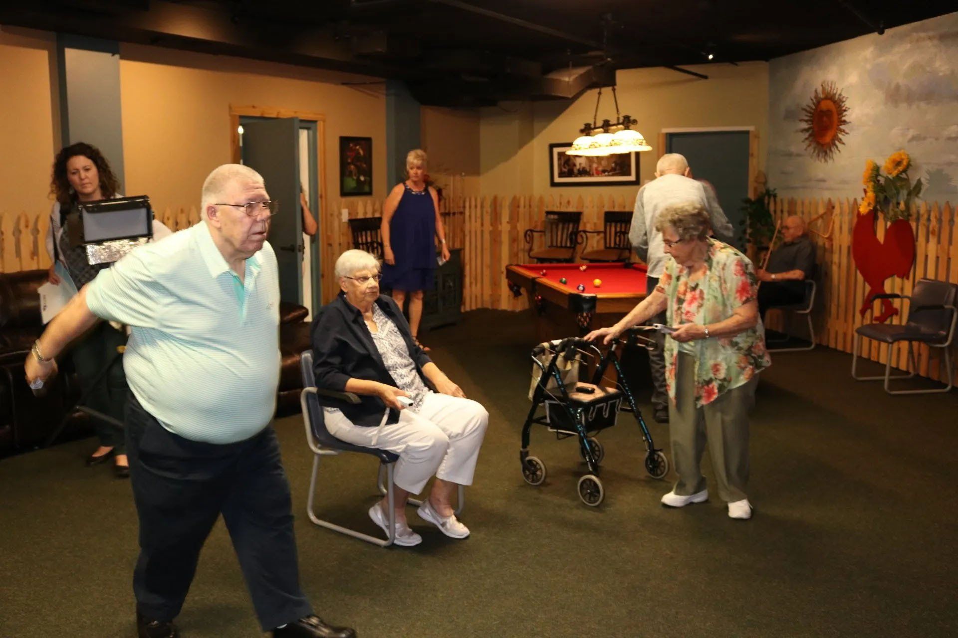 Happy Seniors Enjoy Playing the Wii Gaming Console