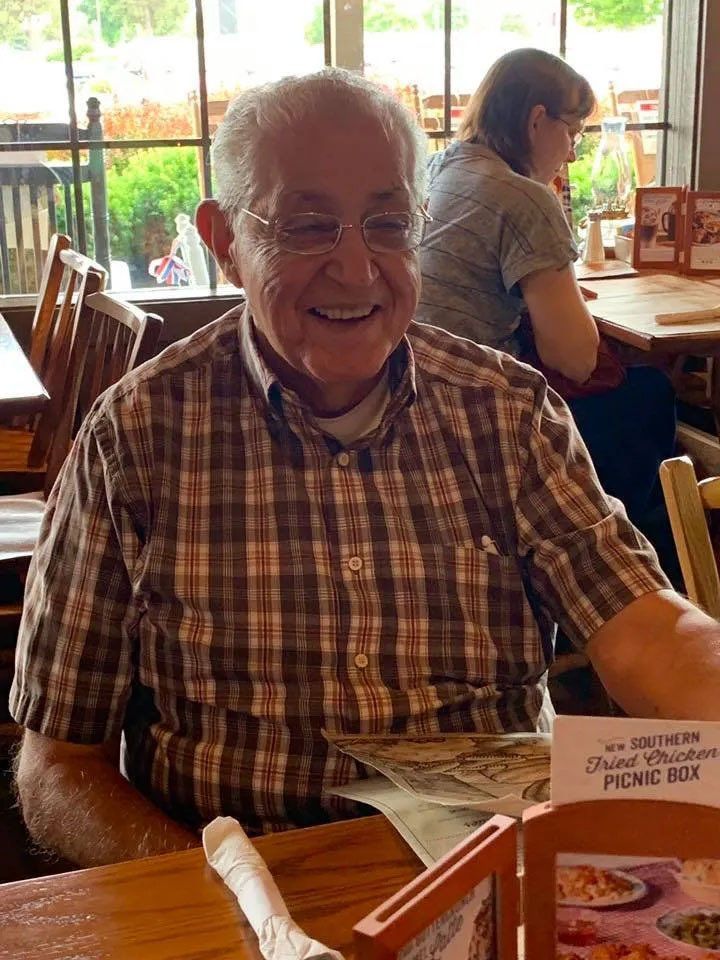 Happy Senior Male at Restaurant