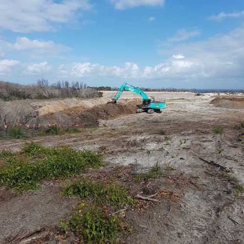 teal excavator