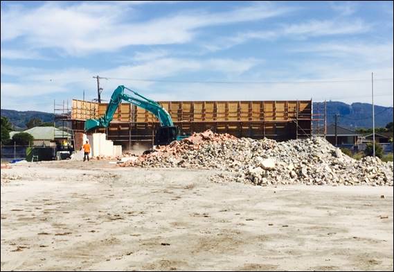 blue excavator at work