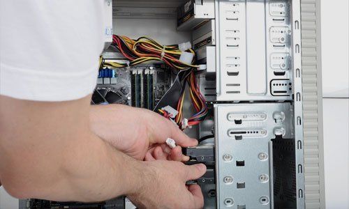 Man servicing a PC