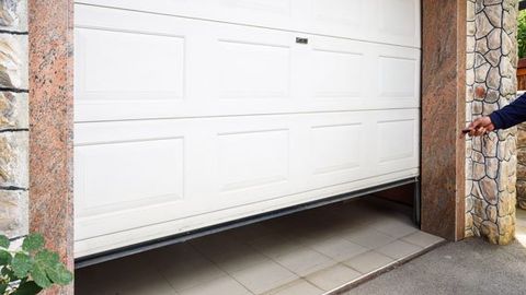 Opening a Garage Door — Okeechobee, FL — A Florida Door Sales Opening a Garage Door — Okeechobee, FL — A Florida Door Sales