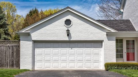 House with White Garage Door — Okeechobee, FL — A Florida Door Sales