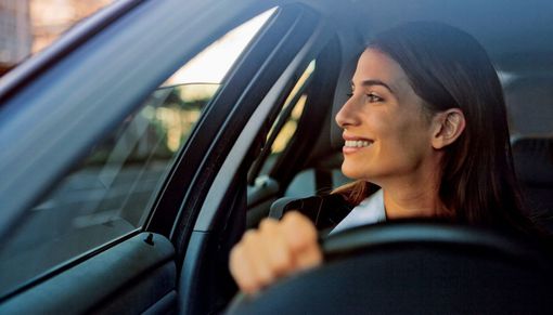 Woman driving her car after having a radiator repair in Wellington