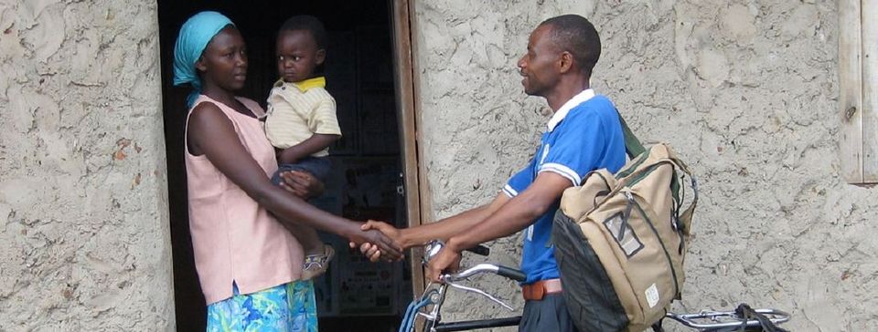 Man shaking woman, holding a baby's, hand
