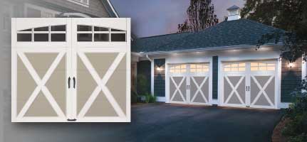 White garage doors with X-shaped accents and windows, set in a house exterior.