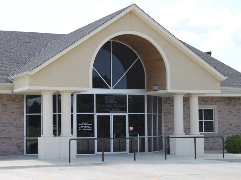 The front of a building with a large arched window