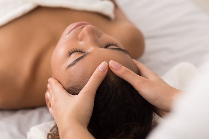 Woman Enjoying Facial Massage — Hudson, NY — Serenity Wellness Medical Spa Woman Enjoying Facial Massage — Hudson, NY — Serenity Wellness Medical Spa