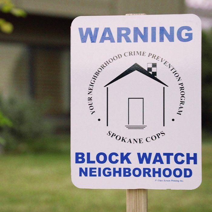 Warning sign in a yard that says 
