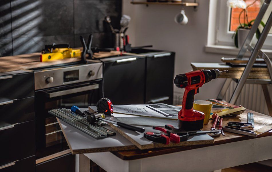Blueprints And Tools In The Kitchen — Worcester County, MA — Cassa Kitchen & Bath Design & Remodeling Center