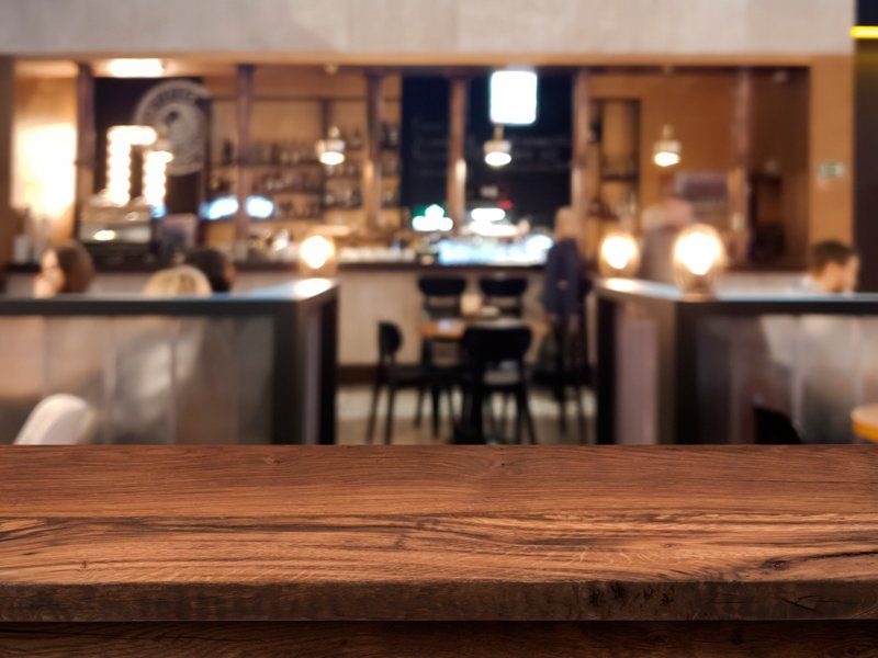 Wooden Table In Restaurant | South Yarmouth, MA | Beach House Kitchen & Bath