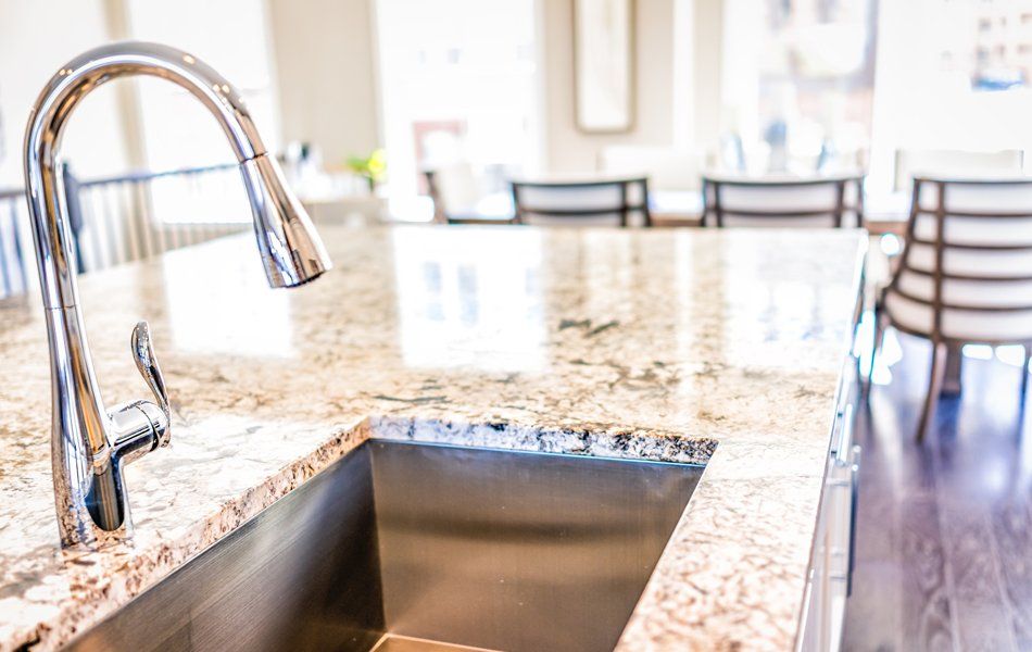 Faucet And Granite Countertops — Worcester County, MA — Cassa Kitchen & Bath Design & Remodeling Center