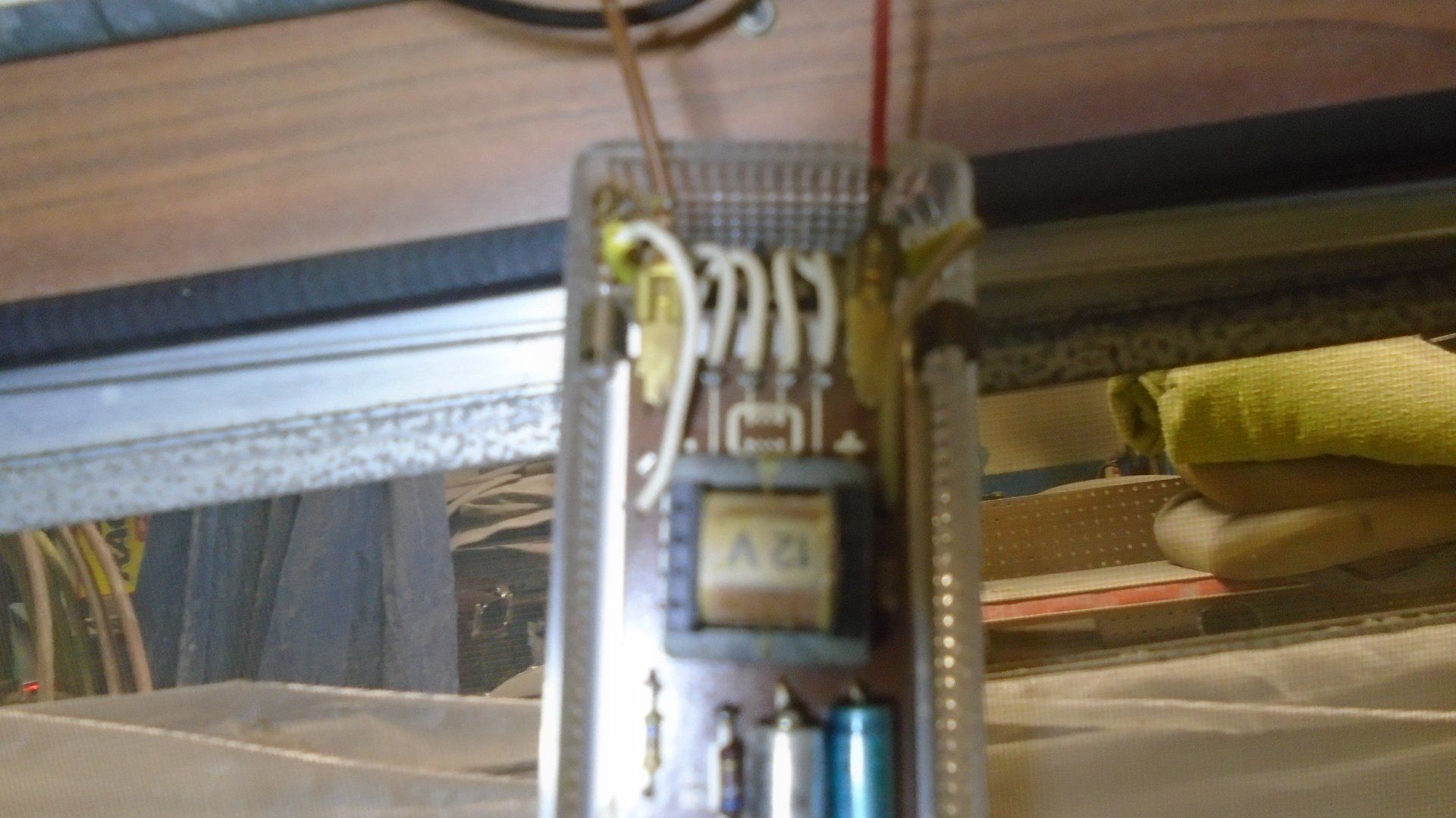 Circuit board with wires and a transformer.