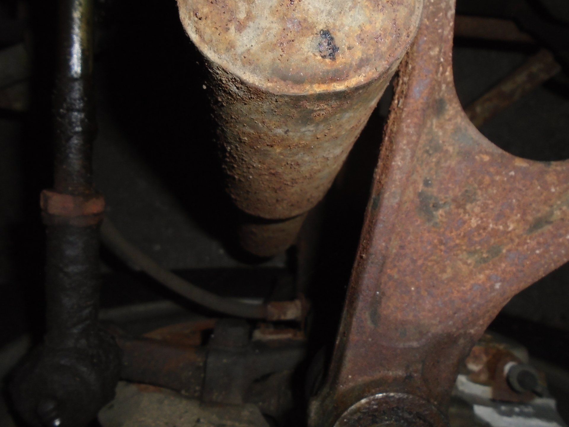 Rusty car suspension parts.