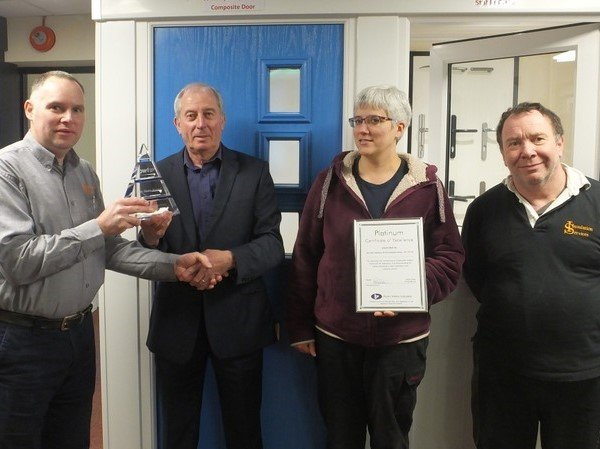 Insulation Services receiving an award from the plastic windows federation