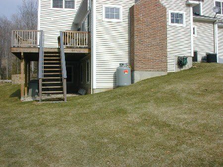 Backyard before landscaping services in Bethlehem, CT
