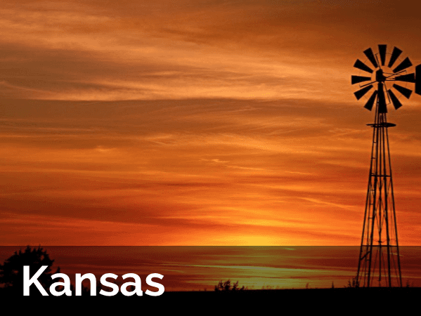Kansas Farm At Sunset A picture of a windmill in kansas at sunset