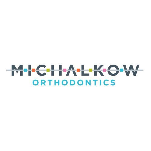 Logo for Michalkow Orthodontics featuring the name with a horizontal line and colorful squares representing braces.