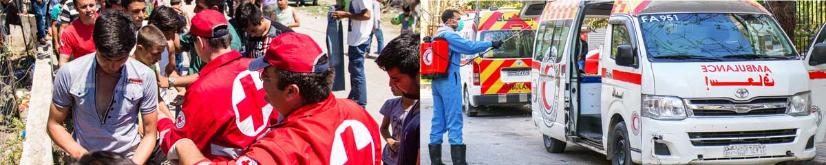 a group of people are standing in front of an ambulance .