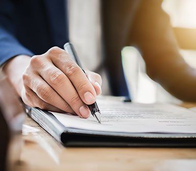 Attorney Writing on Form — Mobile, AL — Green Disability Law Attorney Writing on Form — Mobile, AL — Green Disability Law