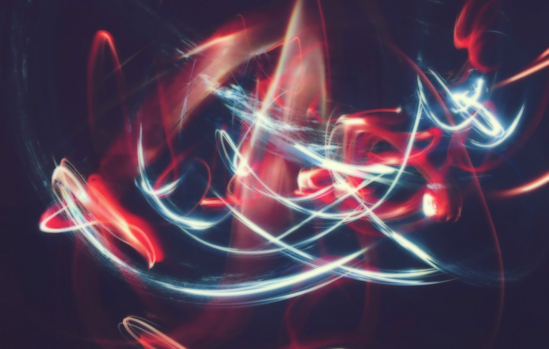 A bunch of lights are moving in the dark.
