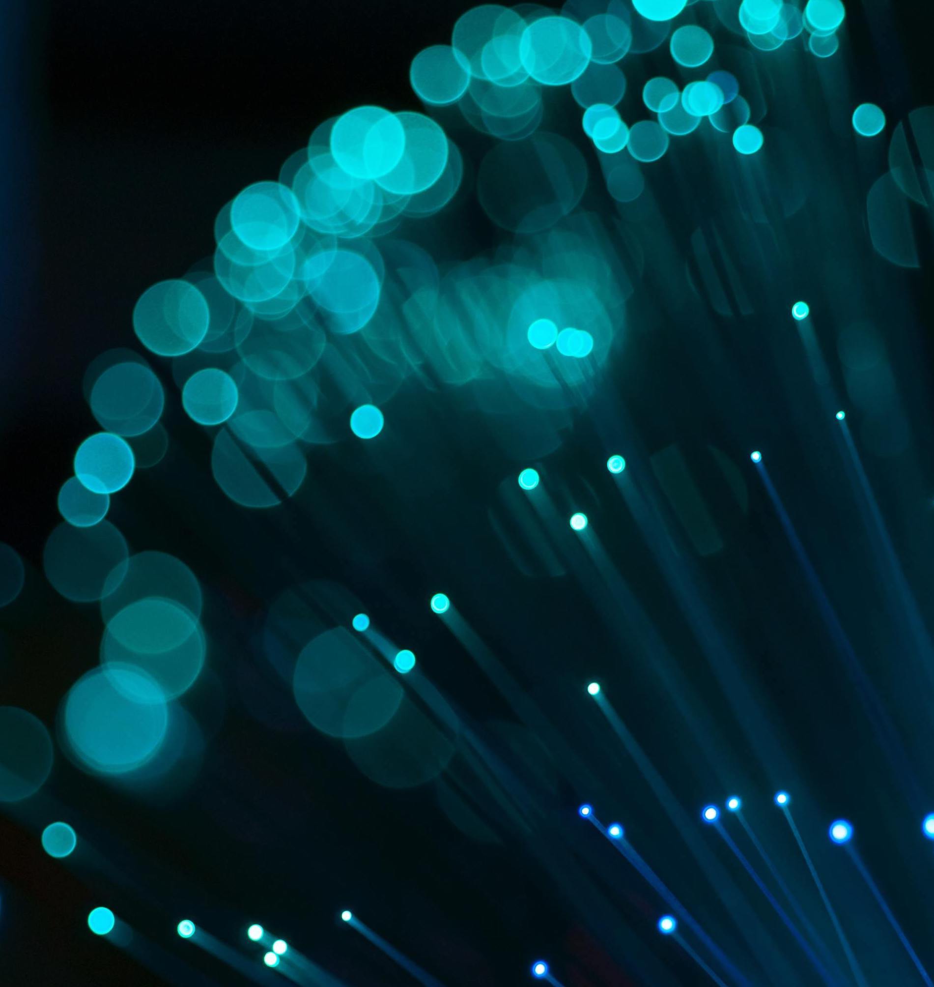 A close up of a bunch of blue lights on a black background