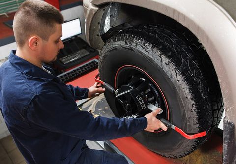 Mechanic Doing Wheel Alignment — Tallahassee, FL — Sirmons Alignment & Brake Mechanic Doing Wheel Alignment — Tallahassee, FL — Sirmons Alignment & Brake