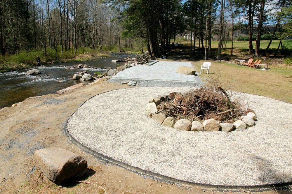 Backyard Patio and Fire Pit During Installation — Pine Bush, NY — Creative Touch Landscaping & Home Improvement Inc.