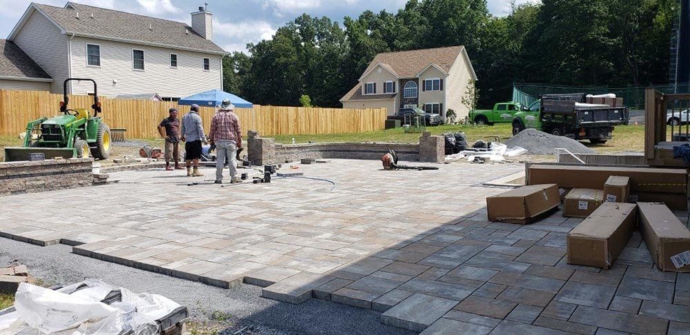 Men Checking the Materials — Pine Bush, NY — Creative Touch Landscaping & Home Improvement Inc.