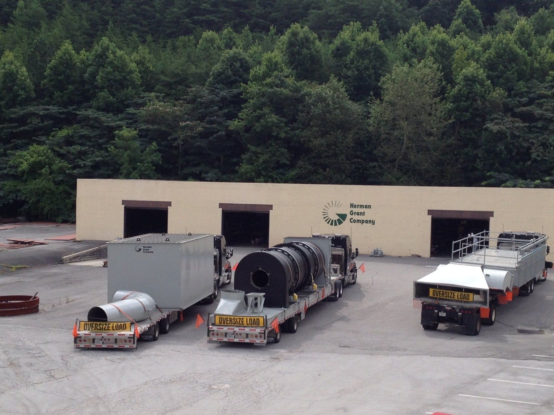 Several trucks are parked in front of a building that says texas inc.
